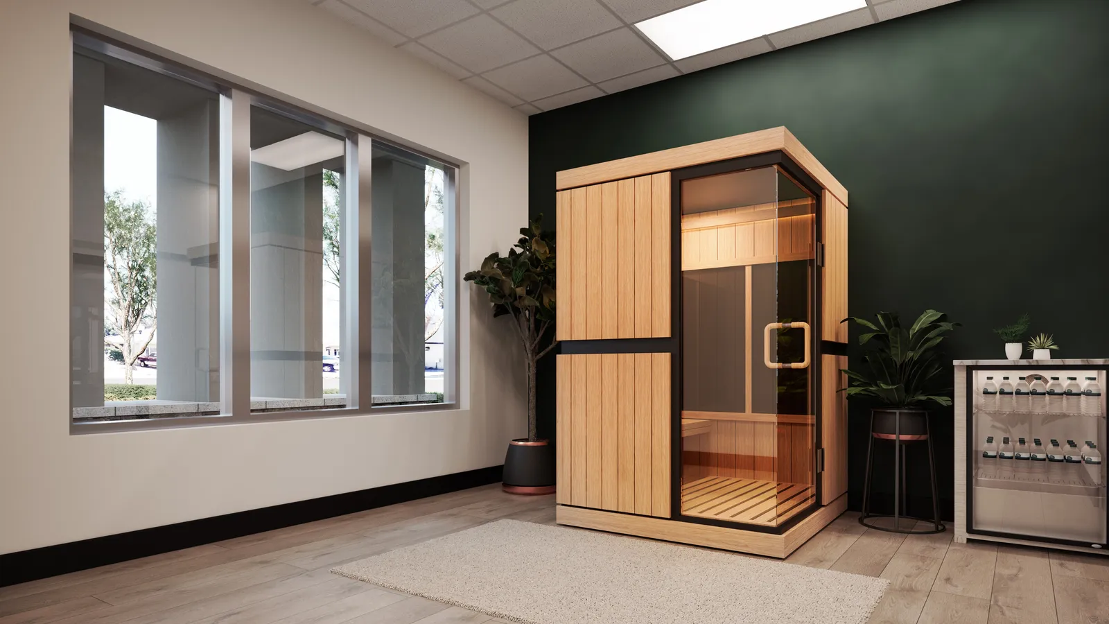 The Valdes Performance recovery suite with an infrared sauna, plants, and a cold-drink fridge against a deep green wall