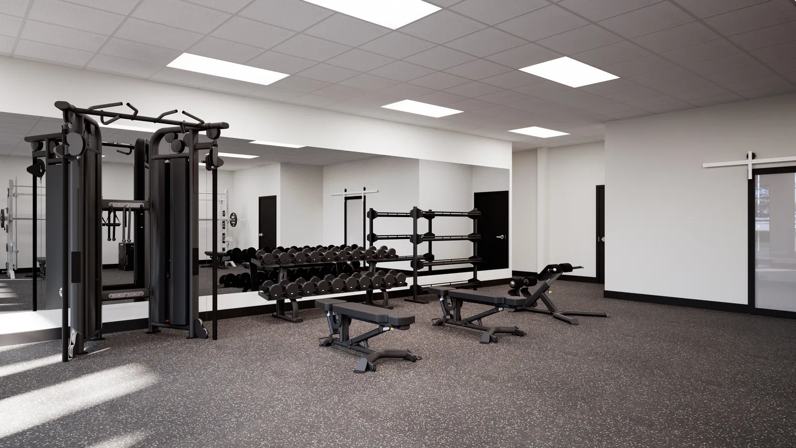 The Valdes Performance strength floor with dumbbell racks, cable machines, and adjustable benches